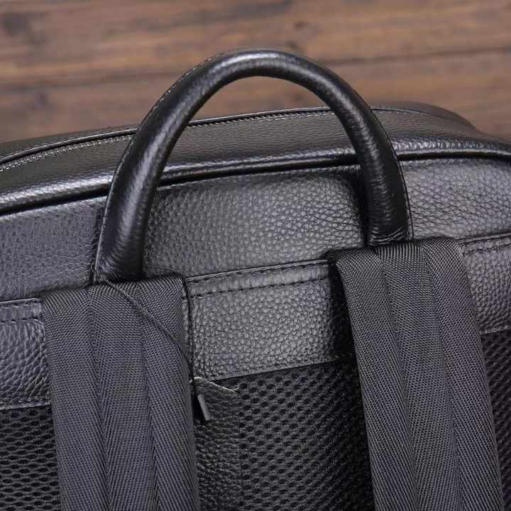 حقيبة ظهر مدرسية للكمبيوتر المحمول مصنوعة من جلد البقر الأسود