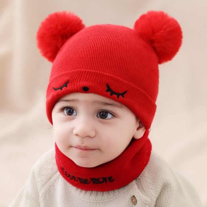Small baby hats embroidered with eyes