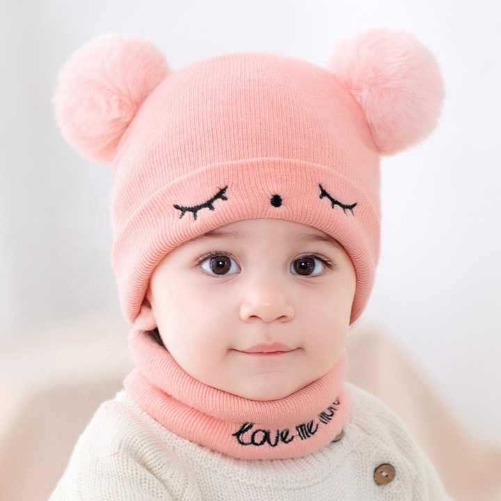 Small baby hats embroidered with eyes