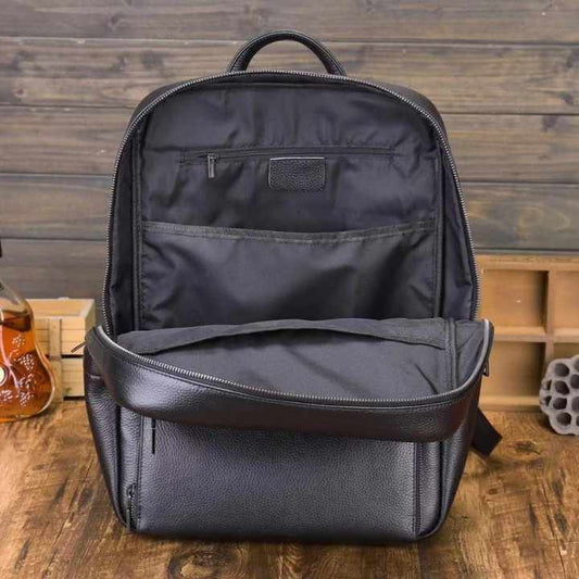 حقيبة ظهر مدرسية للكمبيوتر المحمول مصنوعة من جلد البقر الأسود