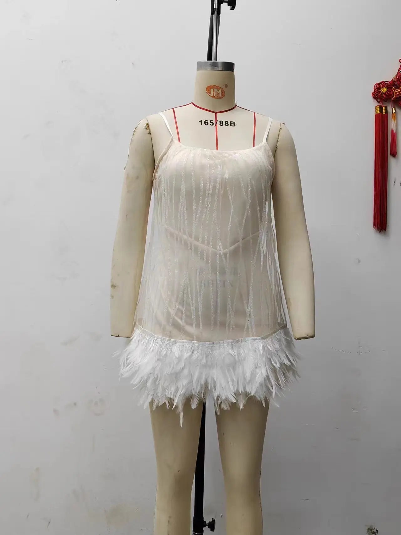 Elegant sequin dress with embellished hem