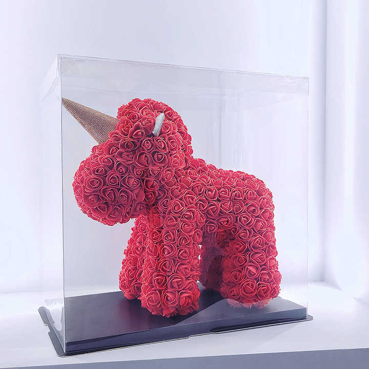 Teddy bear, beautiful soap doll holding flowers in the shape of a pink bear 