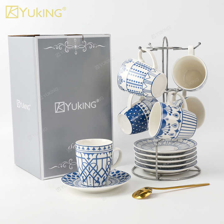 cups and saucers . الكؤوس والصحون
