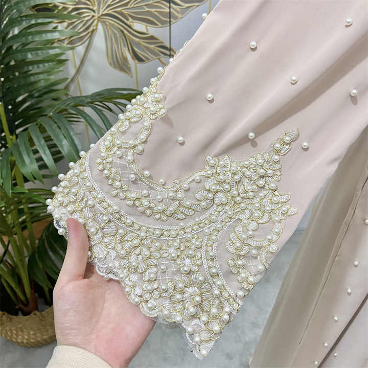 Women's abayas studded with pearls 