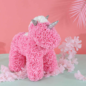 Teddy bear, beautiful soap doll holding flowers in the shape of a pink bear 