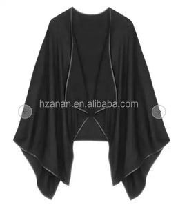 Plain knitted poncho with slit 