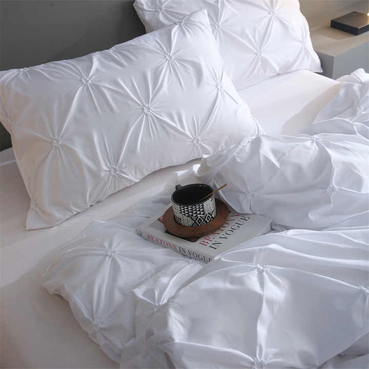 Luxury light bedding set, floral embroidery technique. 