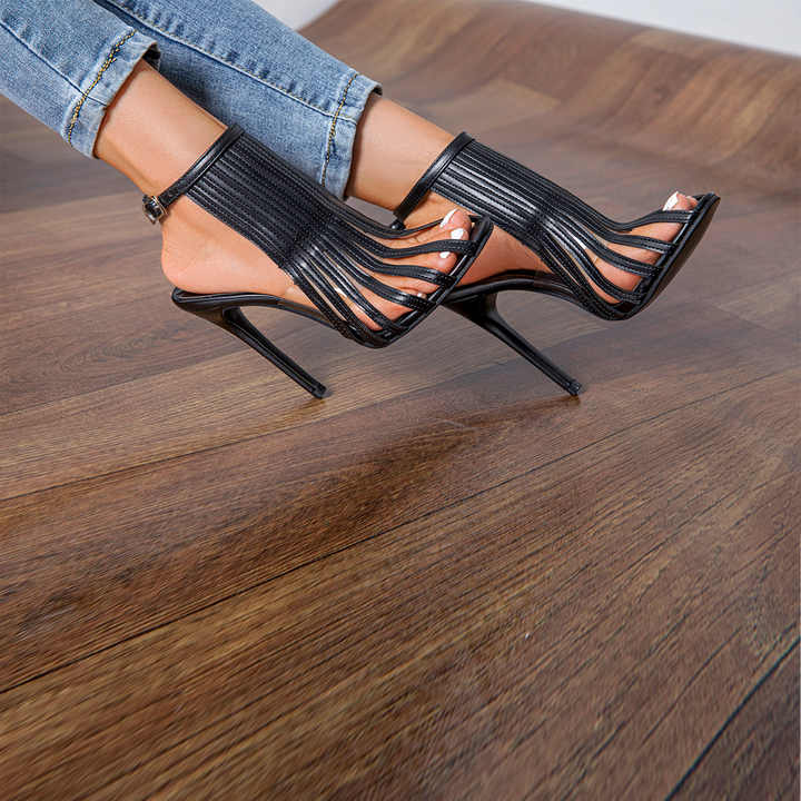 Luxury women's sandals designed with a custom metal buckle and 