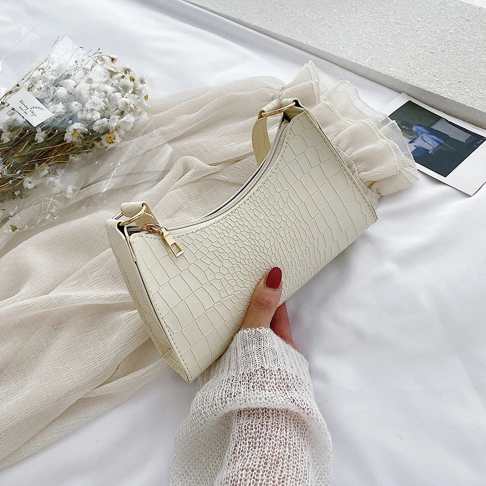 Elegant women's handbags made of PU leather with snakeskin print